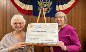 SHS President Lori Mayr and Treasurer Susan Bigler displaying check for recent NCCF grant