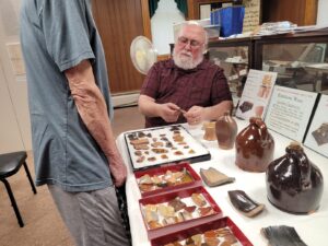 Vincent Martonis shares artifacts from his collection of Haven & Kenyon pottery pieces in June 2024 program at the historical society